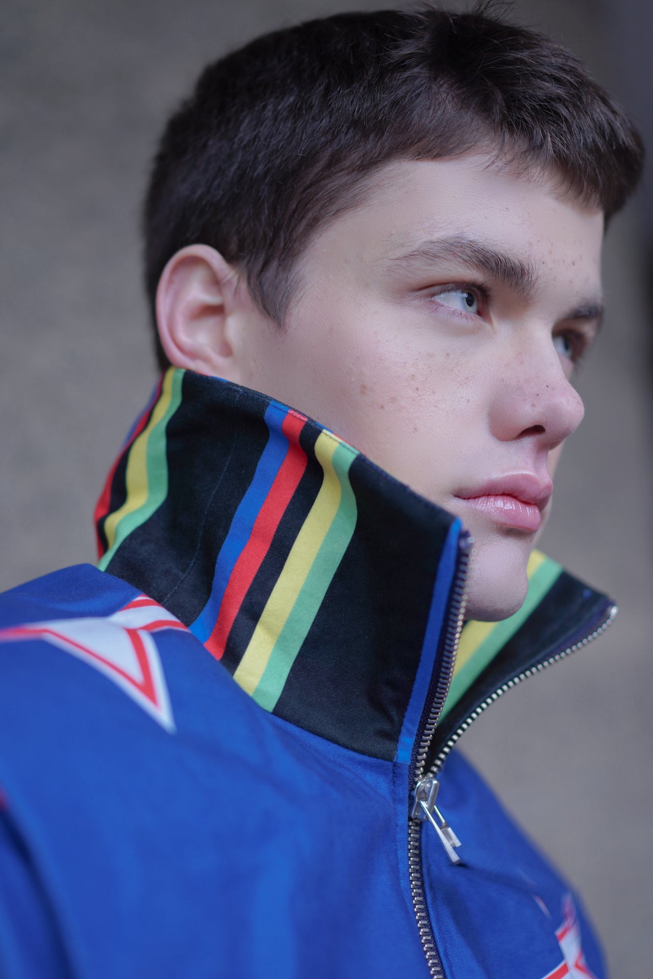 Side profile shot of model wearing YYAtomic 2-in-1 denim jacket. 